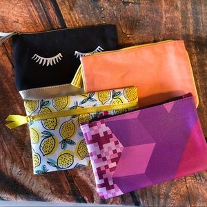 4 i spy specialty bags. All small makeup bags.
